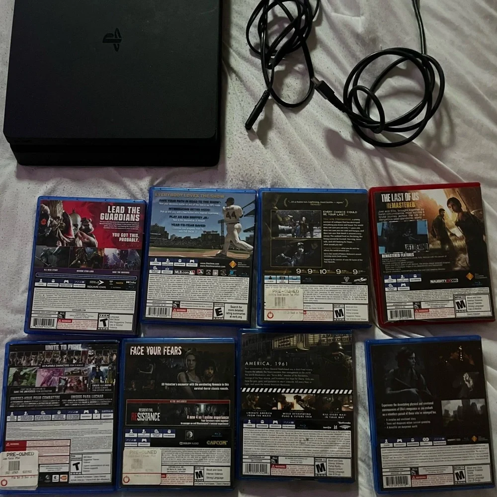 Sony PlayStation Console with Black Finish and Game Collection